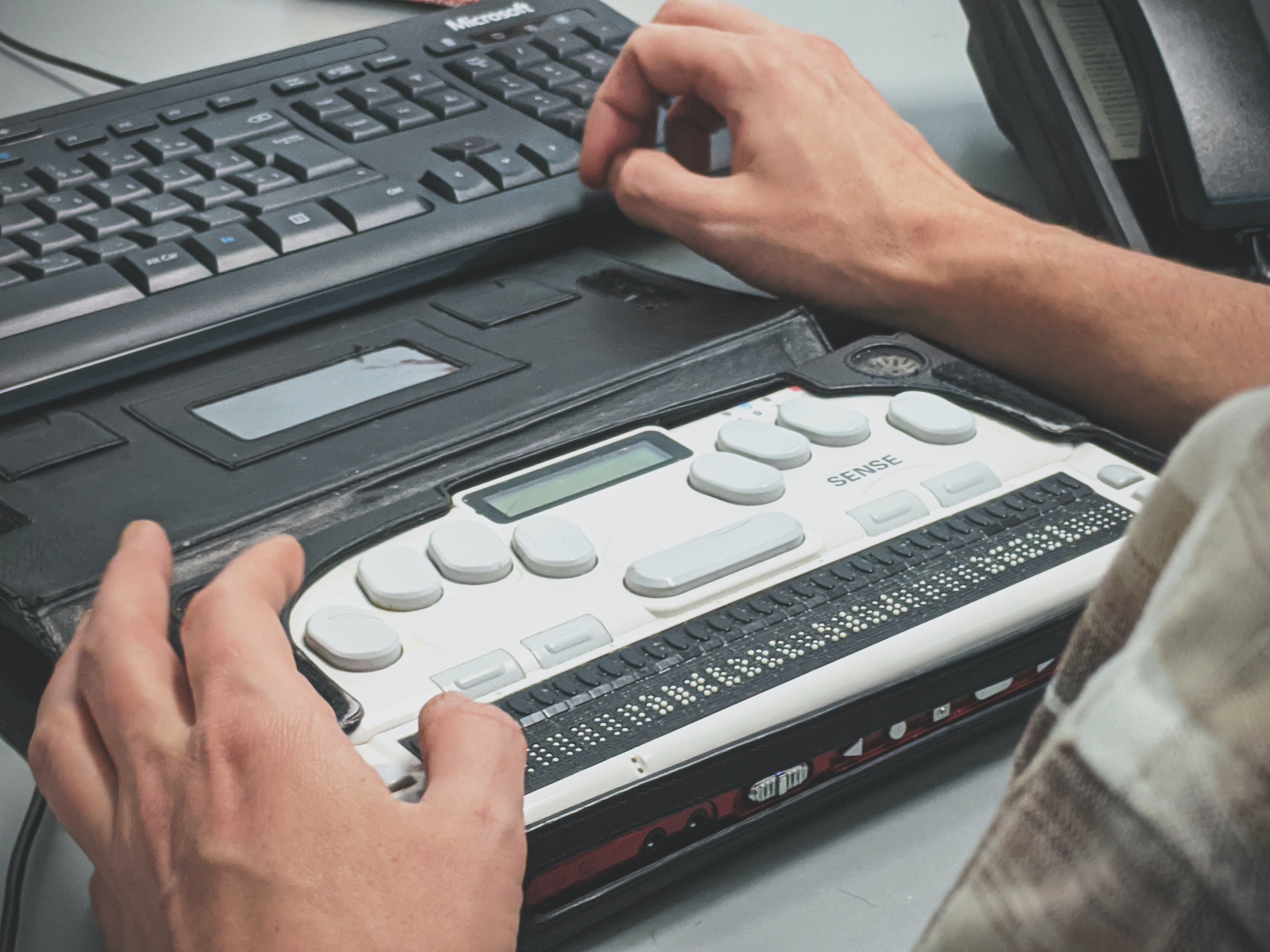 Braille keyboard being used with a laptop