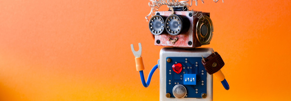 Little robot on orange background