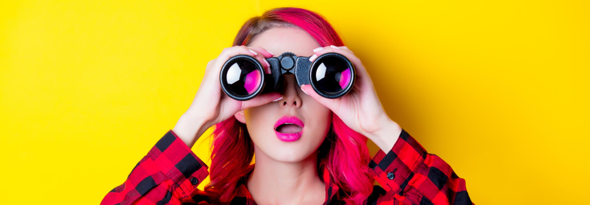 Young woman with binoculars