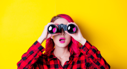 Young woman with binoculars